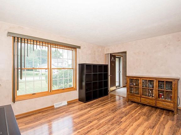 LIVING ROOM HAS HARDWOOD FLOORS, NEWER WINDOWS, NEUTRAL DECOR.