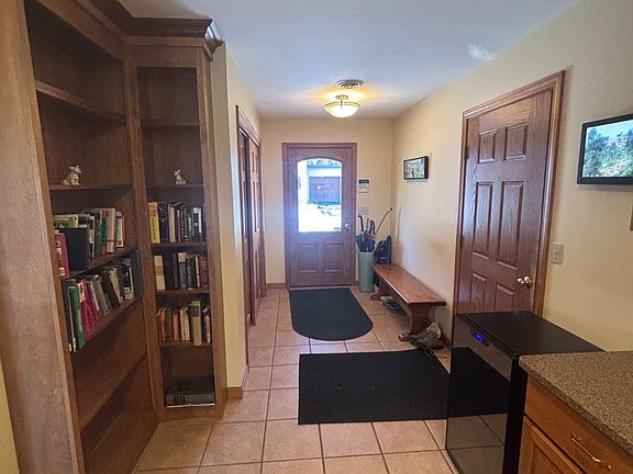 Entry, door to the side is to the garage