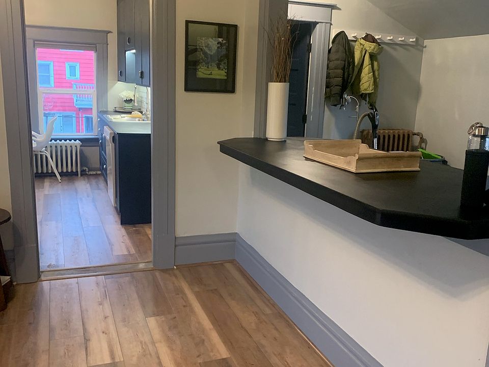 Living room looking into kitchen and bar.