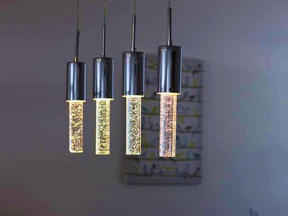 Elegant modern pendant lights with sparkling crystal accents.