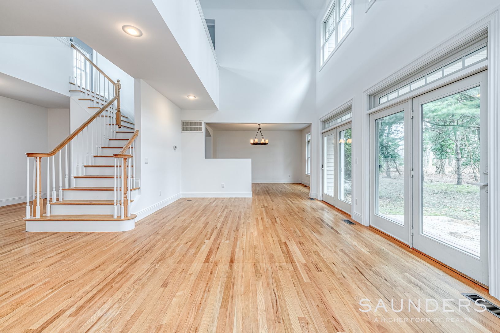  Main living room with lots of room for sectional, club chairs, huge coffee table and end tables 