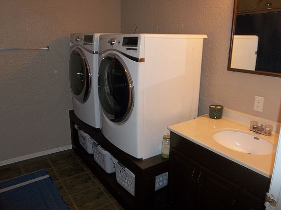 Upstairs Bath and Laundry
						:
						There is also a large stand-up shower opposite of the washer and dryer.