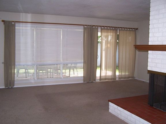 Cozy, corner-style fireplace in Living Room