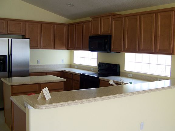 Maple Cabinets,Corian Counter Tops
