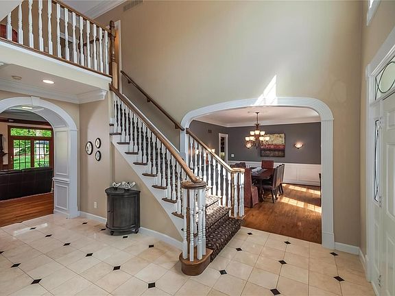 Gorgeous marble flooring. Arched entries to dining, living and family room .
