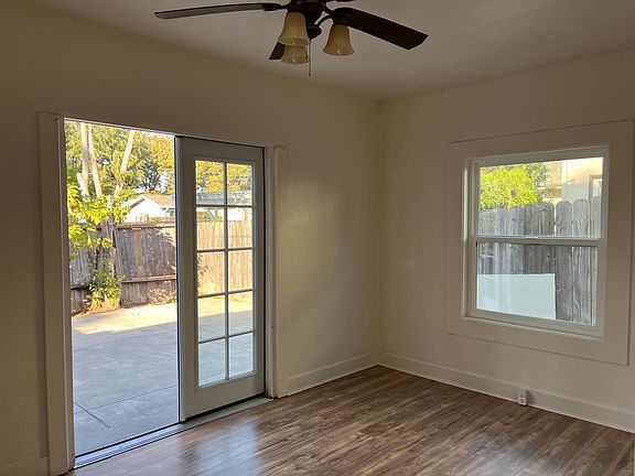 Bedroom with doors leading to yard