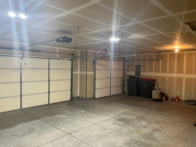Oversized 3 car garage with remote for large garage door.