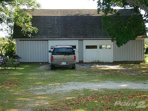 Garage with Handyman area, storage in the back and Loft above