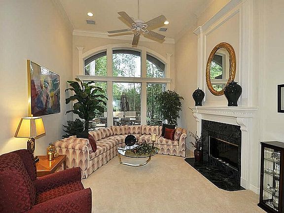 Wow best describes the towering two story formal living area. Located convenient to foyer, dining & kitchen, this room exudes elegance! The fireplace is double sided see through with mantels! Unbelievable private back yard & colorful flower views!!