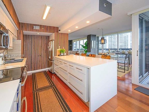 5th image of 3600 Mystic Pointe Dr APT 718
