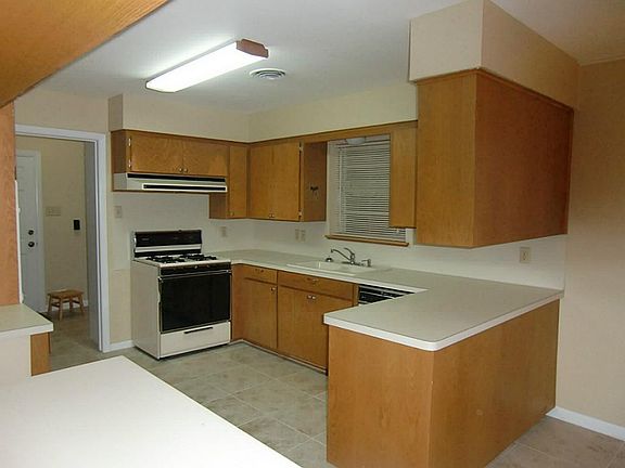 Kitchen with new paint, hardware and tile floors