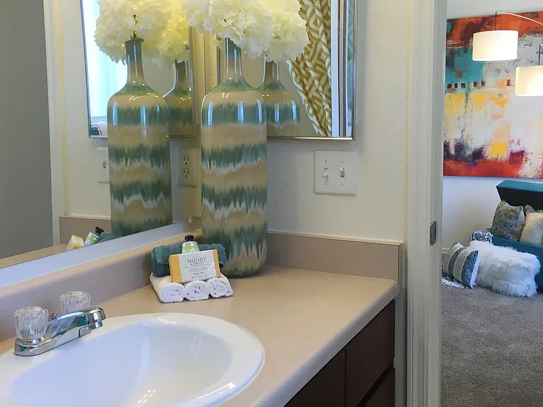 Our ensuite master bathroom features a generous vanity and a stylish, oversized mirror.