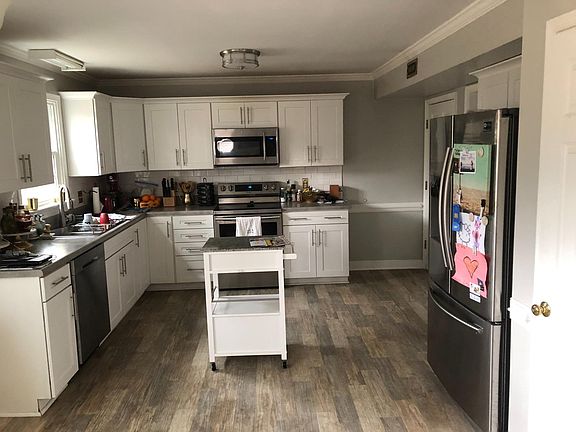 Renovated kitchen with new appliances.