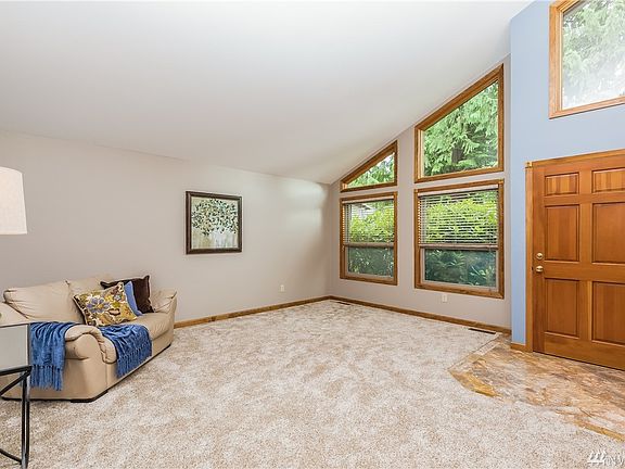 Entry Greets your Guests with Marble Tile Floor.  Spacious Living Features Vaulted Ceilings, Updated Vinyl Windows & Wood Wrapped Trim & Double Closets.  Fresh Interior Paint & New Carpeting throughout!