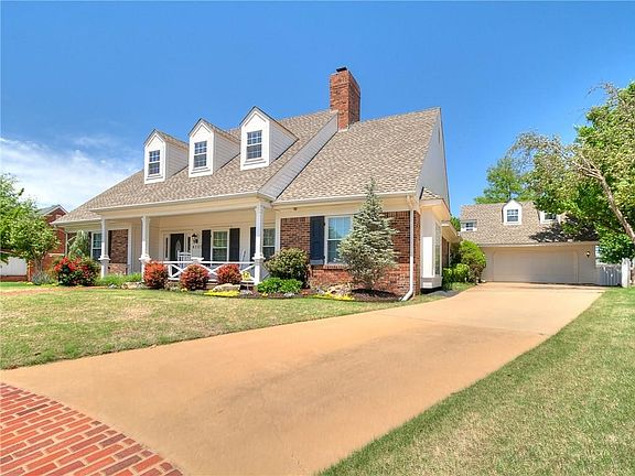 The semi-attached garage has a covered walkway from the home to the garage.  Plenty of extra parking in this driveway.