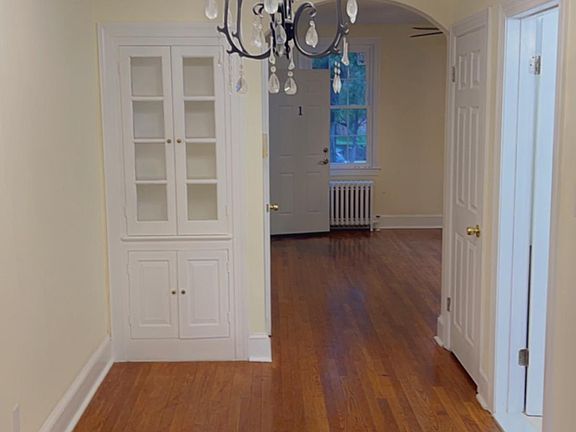 Dining room w/classic lighting and built-in pantry cabinet