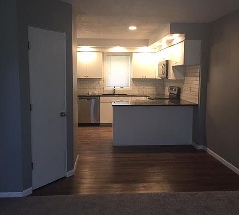 Living room overlooking kitchen & small dining area