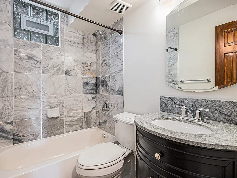 2nd full bath downstairs off of living area / family room and used by both downstairs bathrooms. There is a 1 /2 bath as well.