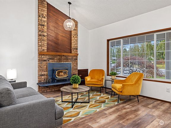 Living room with vaulted ceiling... >