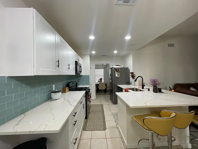 Remodeled kitchen with quartz countertops stainless steel appliances included.