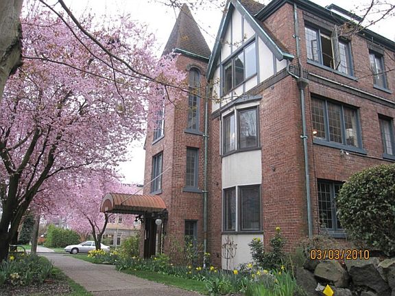 Unit is the middle one with lights on. This is an early spring shot. Tree lined, historic block.