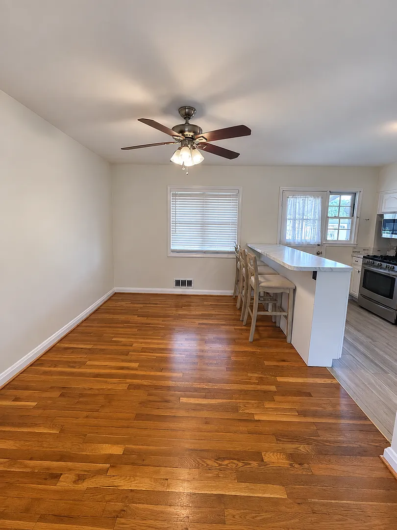 Charming 3-Bedroom Home with Hardwood Floors & Covered Parking — Photo 4