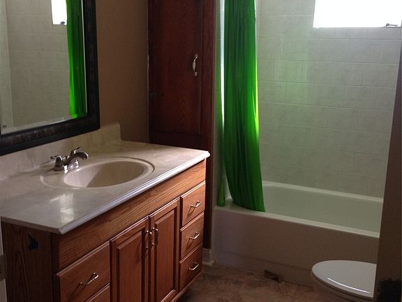 Hall bath has plenty of counter space and storage