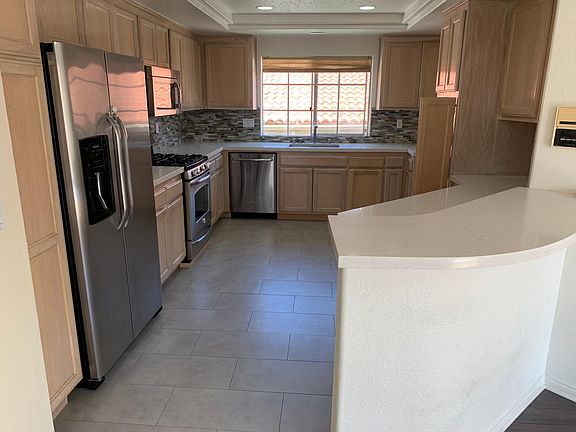 Remodeled kitchen (Caesarstone countertops, extra large stainless steel sink, all stainless steel appliances and porcelain tile floor)