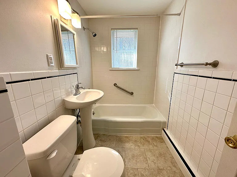 Ceramic tile bath with tub/shower.
