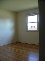 View of Bedroom - Hardwood Floors Under Carpet