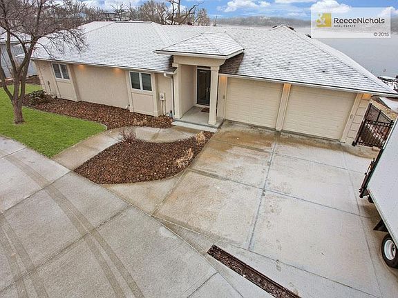 Two-car front-entry garage, two-car side entry garage into the lower level, plus a utility garage.
