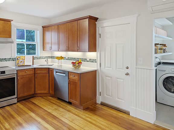 Kitchen and pantry with in-unit washer and gas dryer