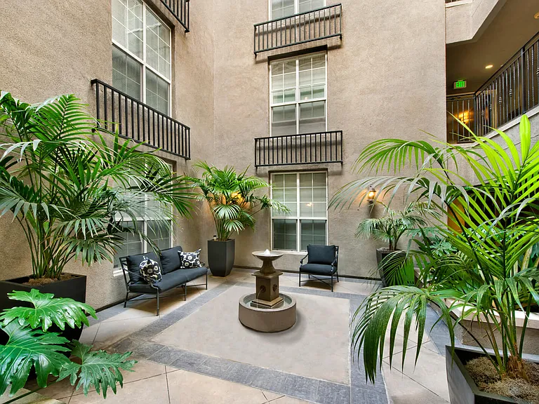Mediterranean-influenced courtyard with formal garden