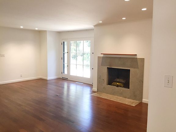 Gas fireplace in living room overlooking front garden