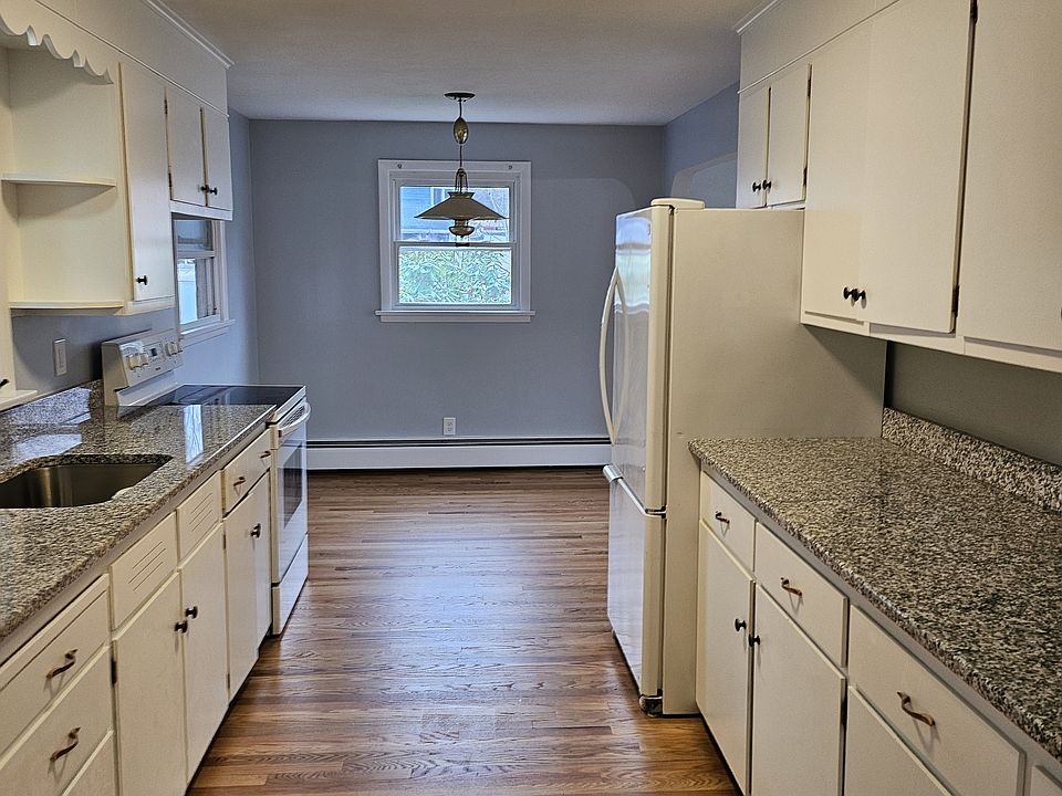 Kitchen to dining area with gleaming new countertops