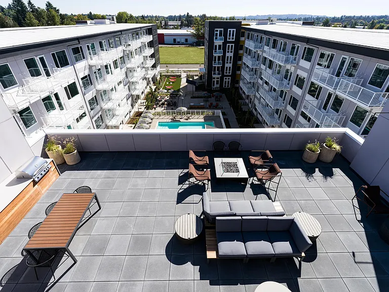 Our 5th floor outdoor deck features lounge seating and a cozy fire table, perfect for evening hangouts or sunset views.
