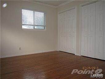 Master bedroom with his and her closet space with organizers!