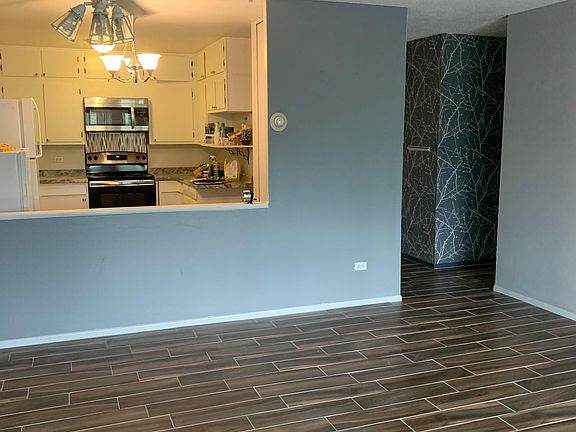 NEW wood tiling throughout condo.