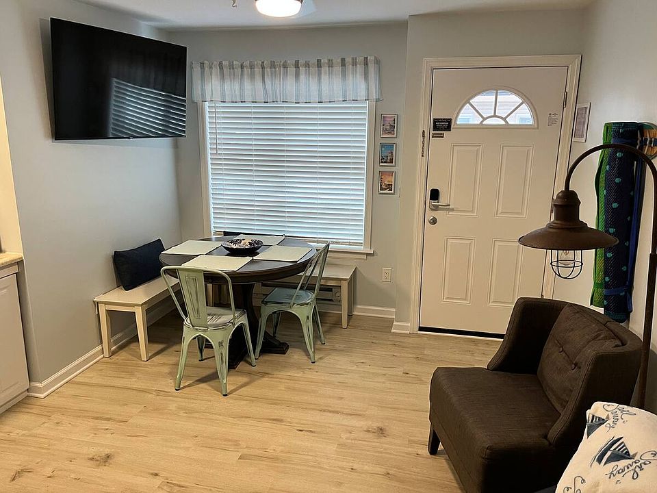 Main entrance, dinette set and TV