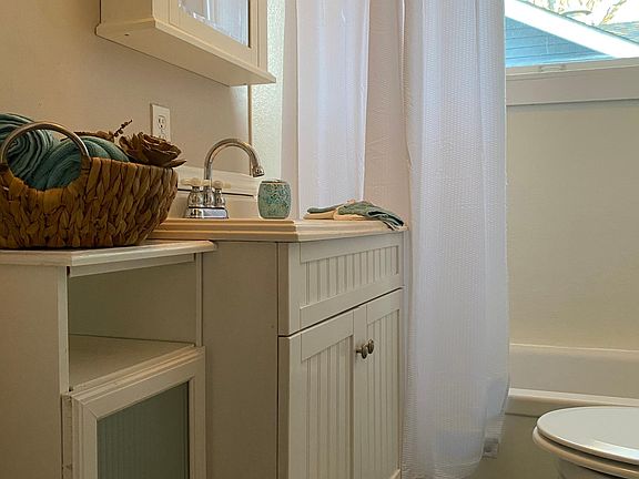 Full bath with plenty of cabinets and new ceramic floors.