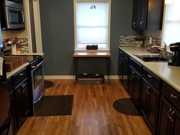 Updated kitchen with microwave, dishwasher and large refrigerator.