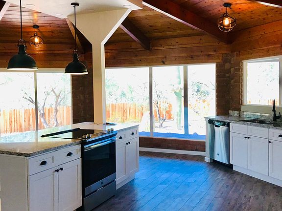 An inviting open and large kitchen with plenty of cabinets
