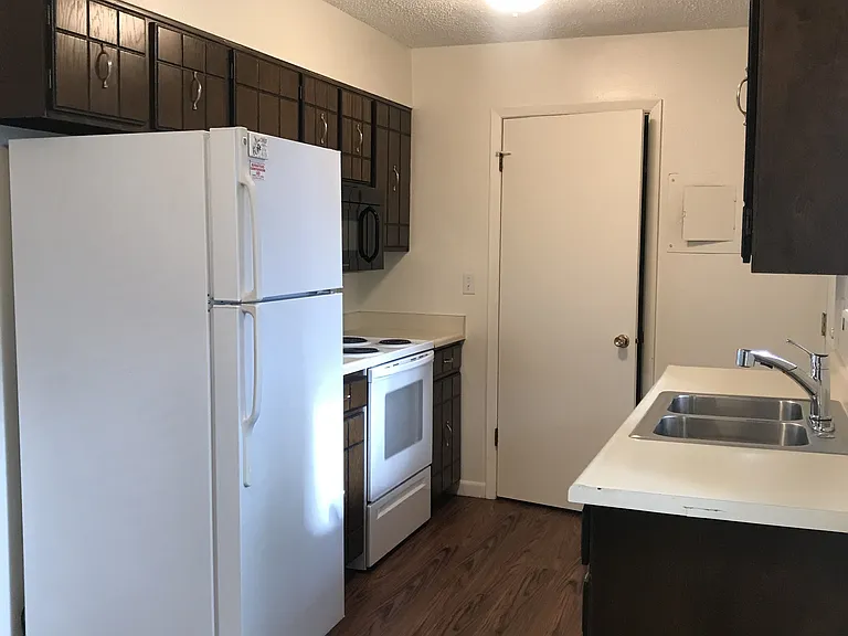 Kitchen with doors to laundry area and to outside patio/garden area