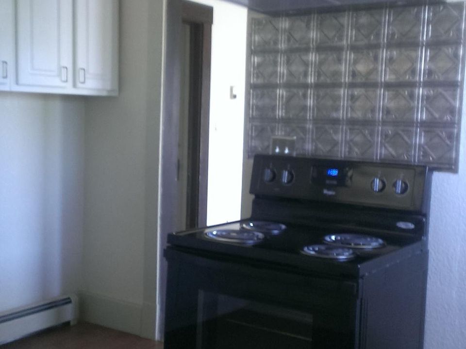 Electric range with fan and light hood