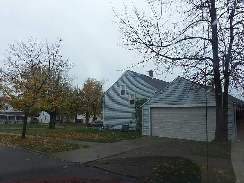 View of garage and side of home from Lincoln Park Drive.