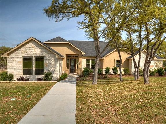 Four sides Austin Stone masonry with upgraded professional landscaping package!