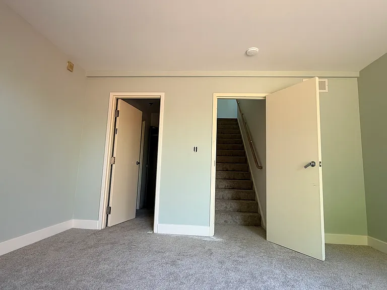 Master bedroom - doors to stairs going to main living area and to the left door to dressing room and ensuite bathroom