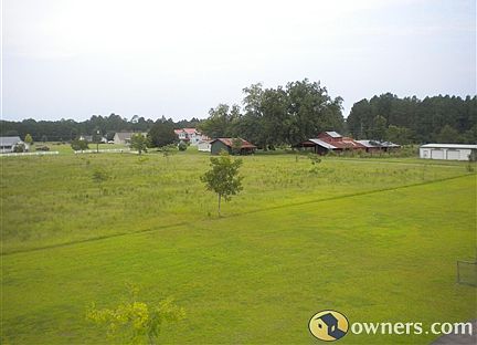 view of front acreage from roof
