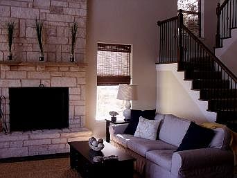 Living Room with Stone Wood Burning Fireplace.