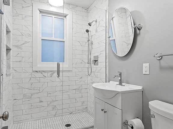 Bathroom renovated in 2024, walk-in shower with shower niche.